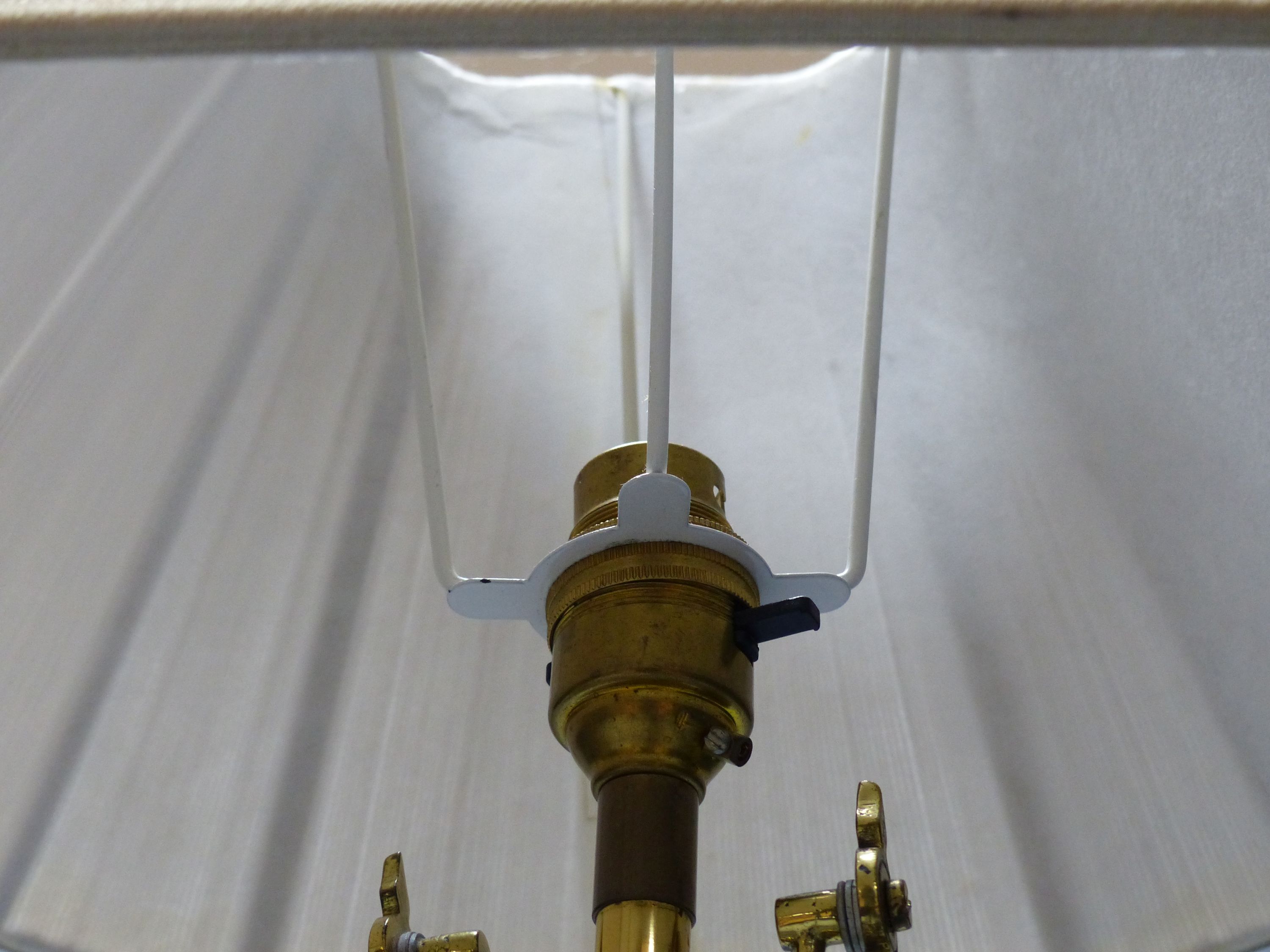 A pair of brass ship’s lamps, height 45cm